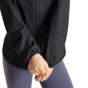 Close-up view of the sleeve on the navy Horze Fiora Lightweight Waterproof Jacket on a white background