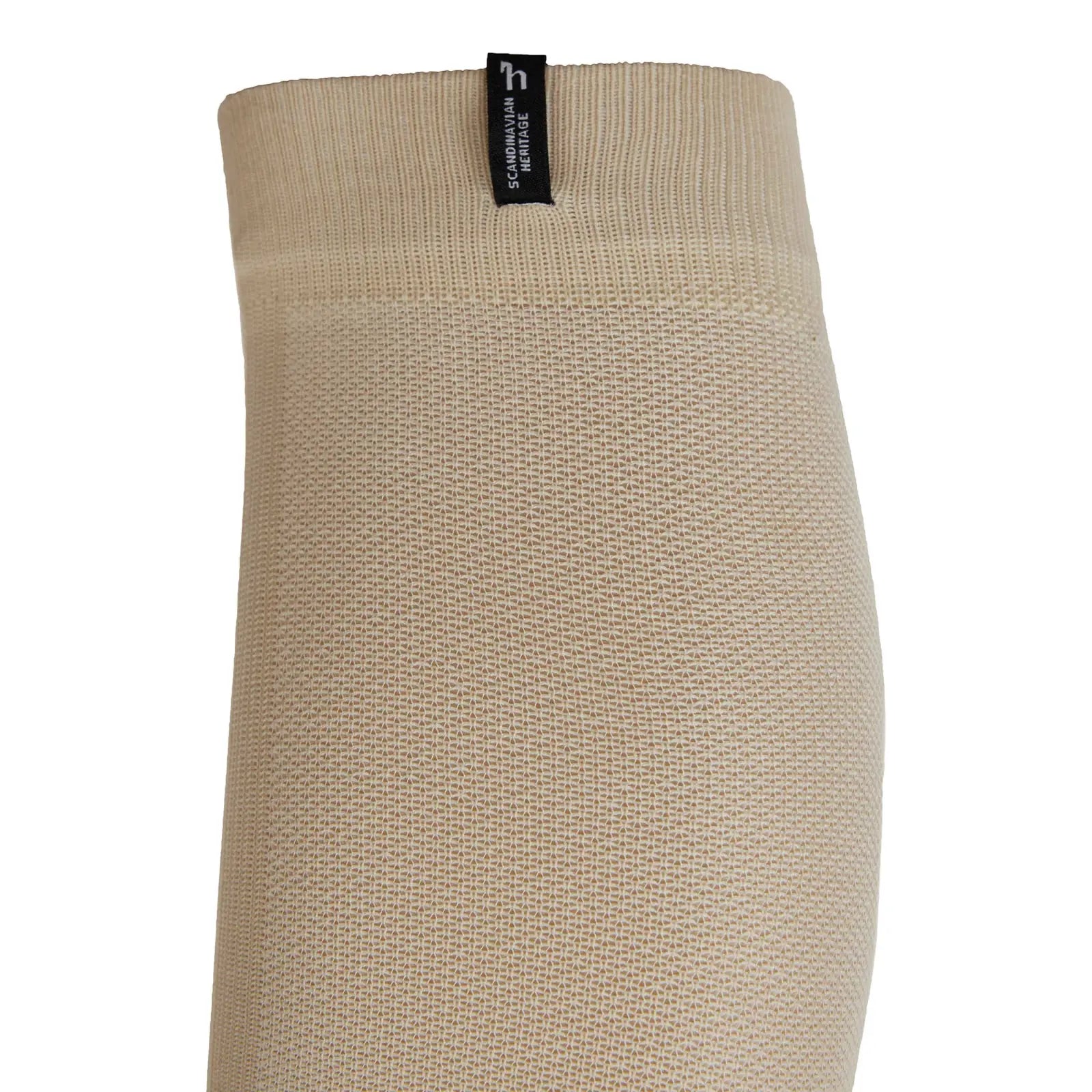 Close-up side view of the top of the Horze Ebba Technical Riding Socks in tan on a white background