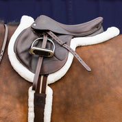Chocolate Brown Equinavia Valkyrie Stirrup Leathers on a jump saddle on a bay horse