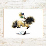 View of the Cat Leap Pony Nut Greeting Card on a white washed wood background