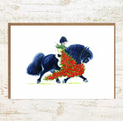 View of the Champ Pony Nut Greeting Card on a white washed wood background