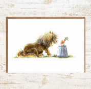 View of the Cupcake Pony Pony Nut Greeting Card on a white washed wood background