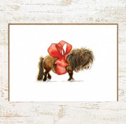 View of the Gift Horse Pony Nut Greeting Card on a white washed wood background