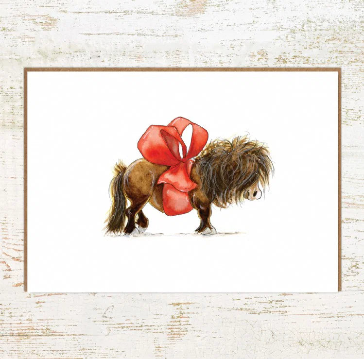 View of the Gift Horse Pony Nut Greeting Card on a white washed wood background