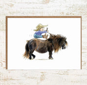 View of the Where's The Go Button Pony Nut Greeting Card on a white washed wood background