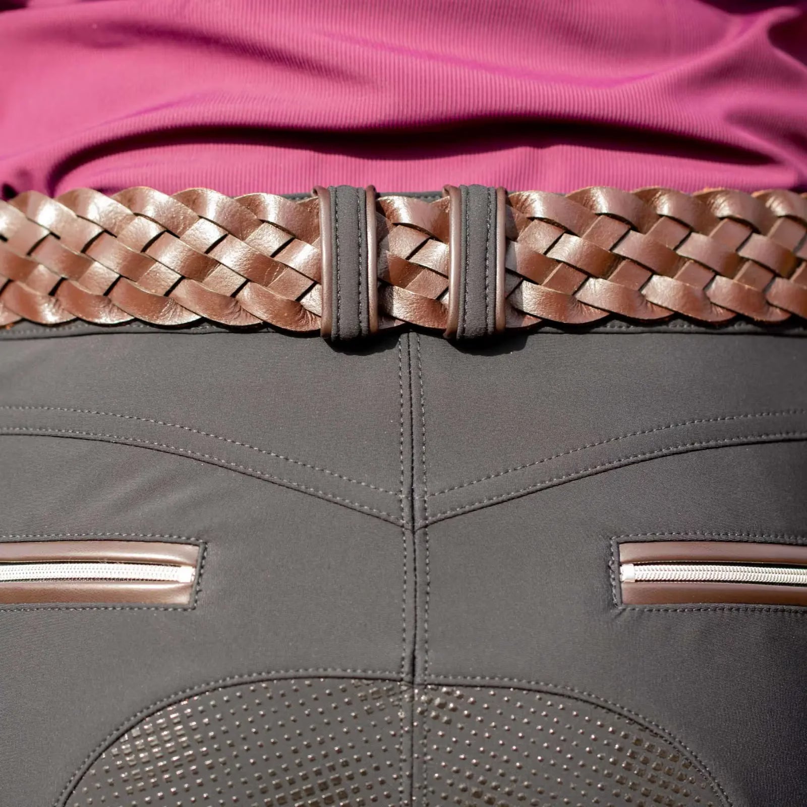 Close-up back view of the chocolate brown Equinavia Kari Braided Belt over black breeches