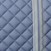 Side closeup view of Dusk Blue Equinavia Harstad Ribbon Dressage Pad