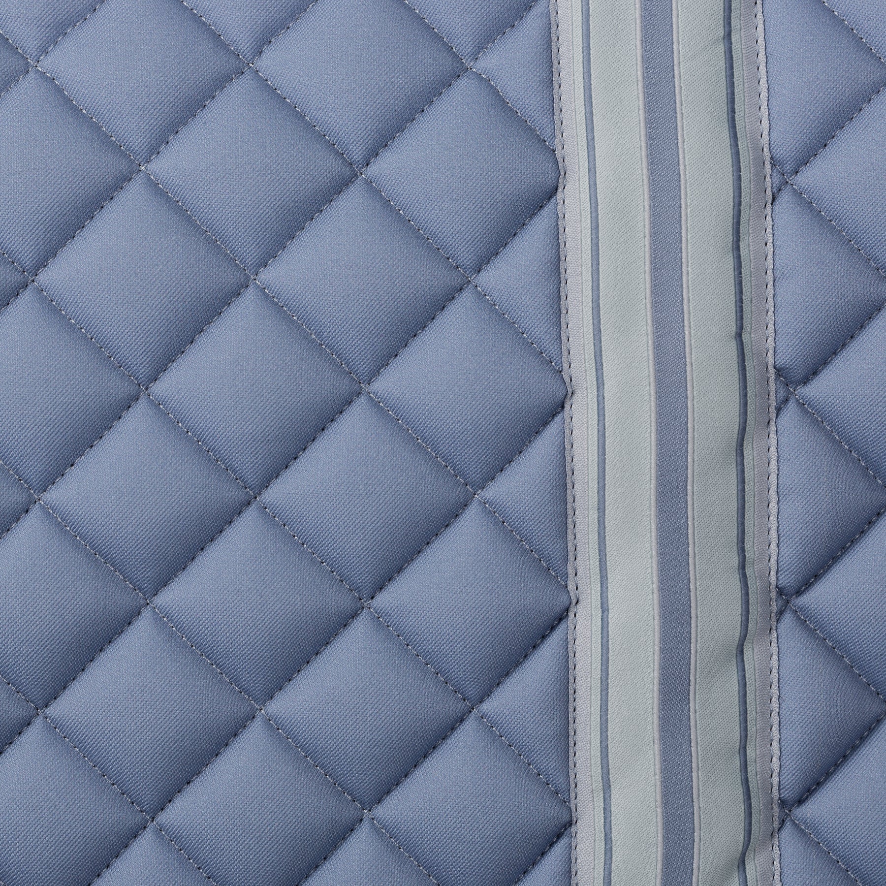 Side closeup view of Dusk Blue Equinavia Harstad Ribbon Dressage Pad