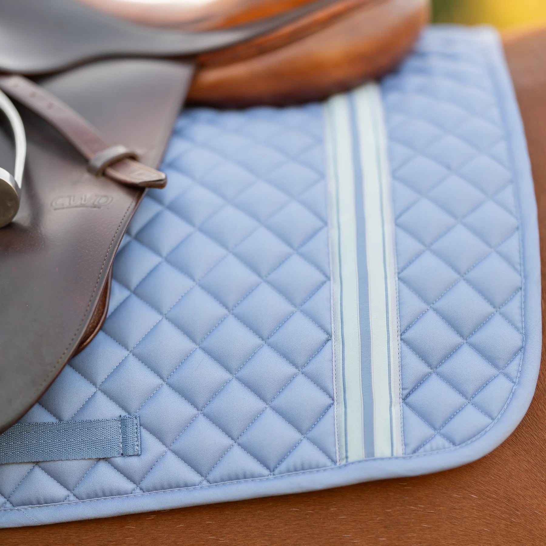 Side closeup view of a horse wearing Dusk Blue Equinavia Harstad Ribbon All Purpose Pad