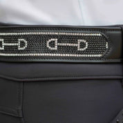 Close-up view of the black Equinavia Erika Crystal Bit Belt over black breeches