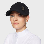 Angled front view of a female model wearing the black Samshield Sadie Pearl Metal Eclipse Cap on a plain background