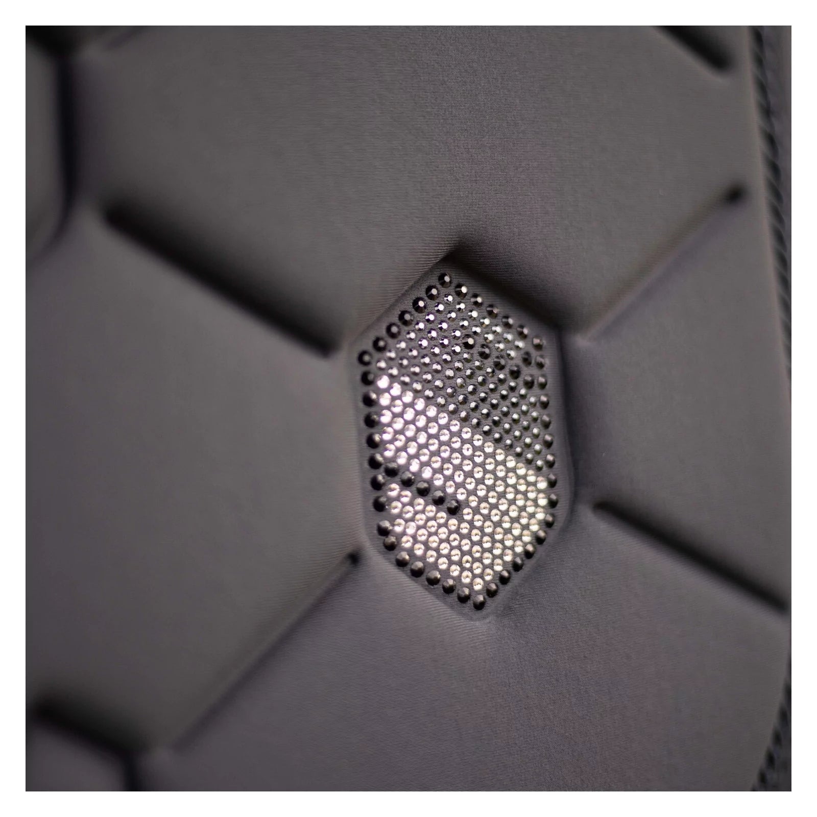 Close-up view of the anthracite swarovski embroidered Samshield Spineshield Jump Pad