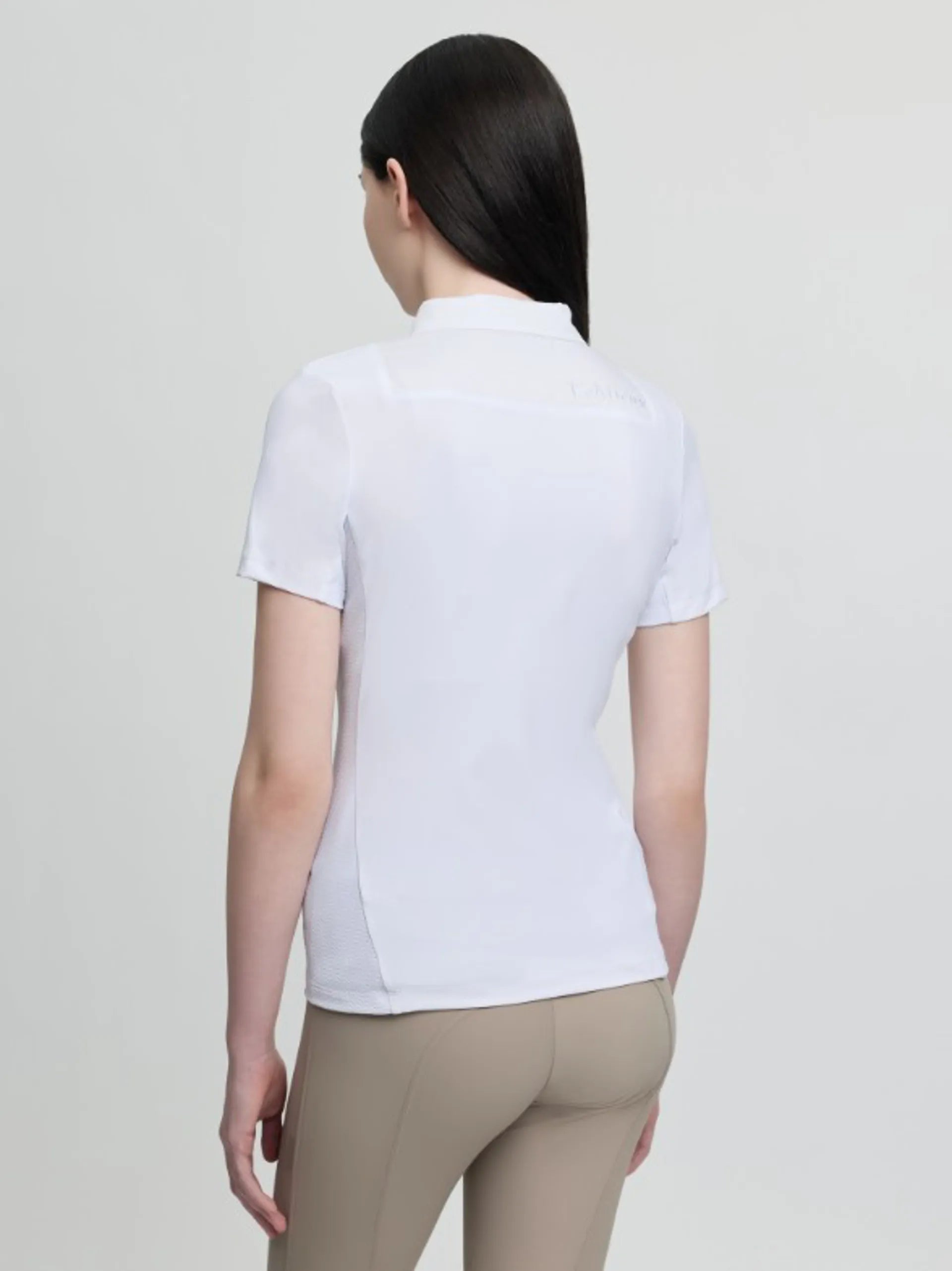 LeMieux Junior Short Sleeve Primrose Show Shirt in white, back view worn with beige breeches