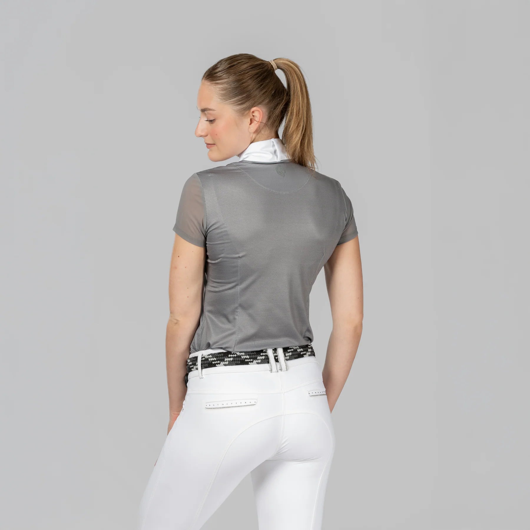 Back view of a model wearing Brushed Nickel Equinavia Martha Short Sleeve Show Shirt on a plain background