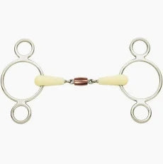 A silver-toned metal double-ring bit with cream-colored cheekpieces and a small rose-gold-colored center pad, shown against a plain white background.