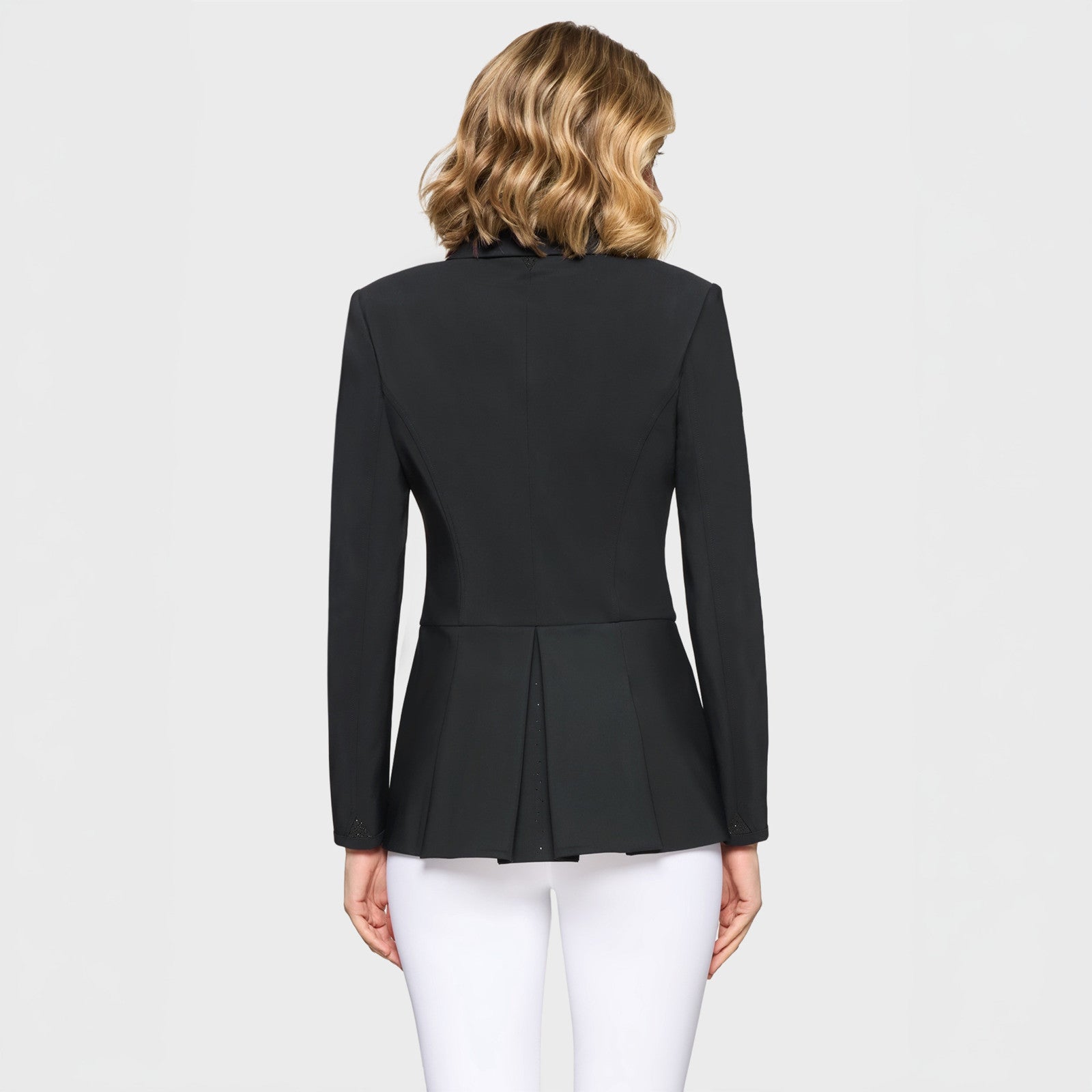 Back view of a female model wearing the Black Samshield Short Frac Crystal Fabric Show Coat on a plain background