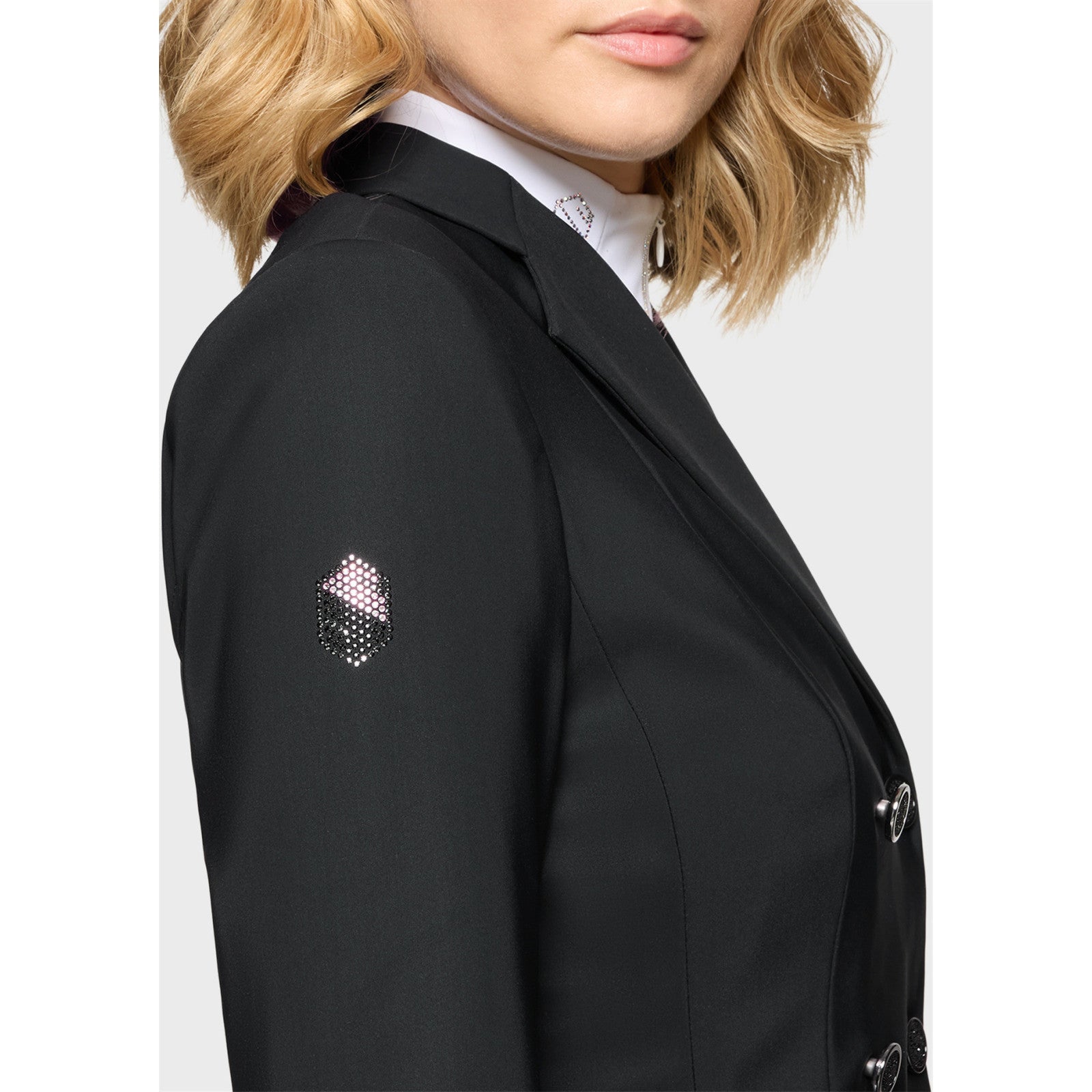 Close-up side view of a female model wearing the Black Samshield Short Frac Crystal Fabric Show Coat on a plain background
