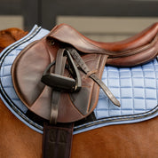 Side closeup view of a horse wearing Dusk Blue Equinavia Copenhagen Stay Put All Purpose Saddle Pad