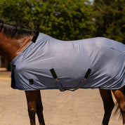 Side view of a horse wearing Dusk Blue Equinavia Torr Quick Dry Cooler