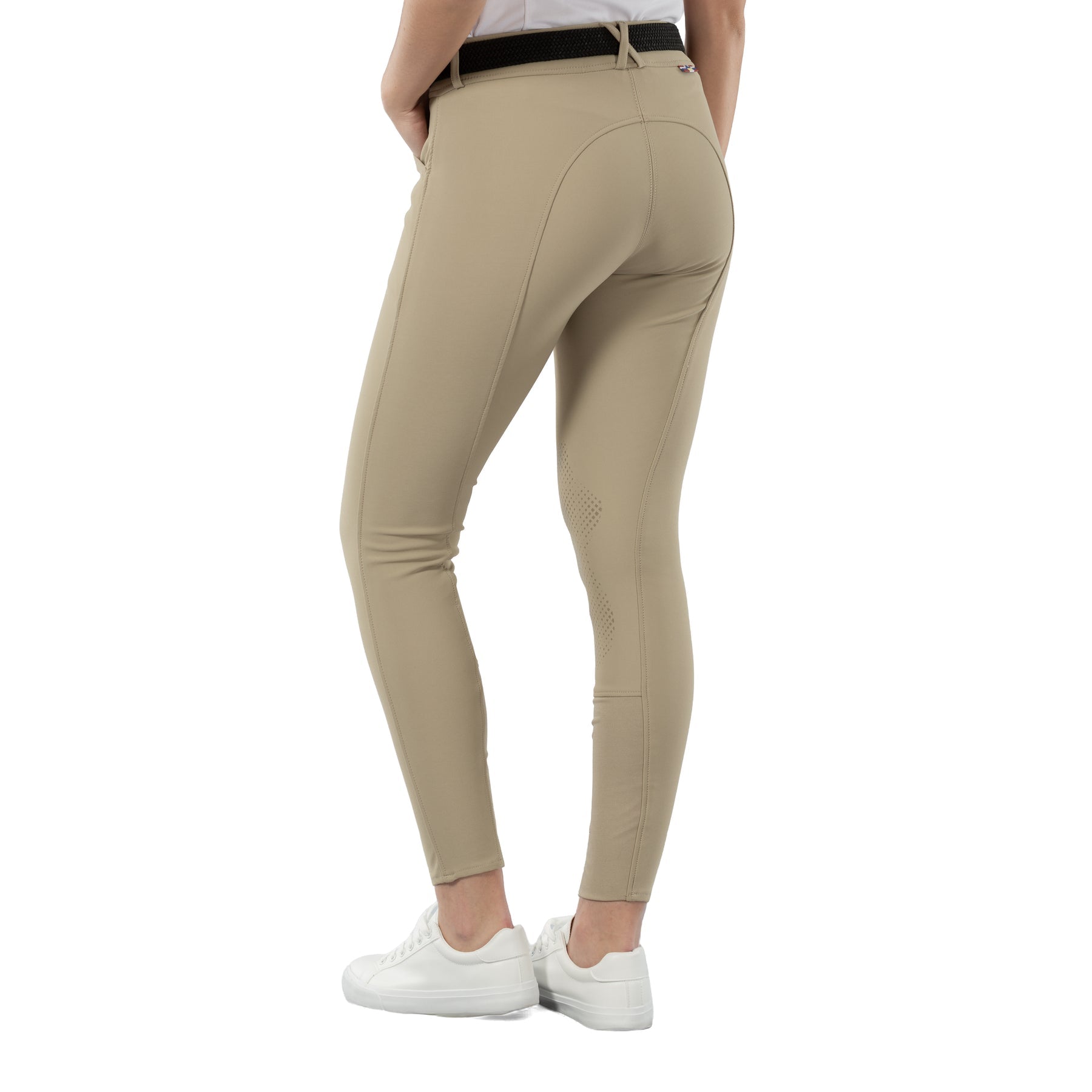 Back view of a model wearing the tan Horze Grand Prix Silicone Knee Patch Breeches on a white background