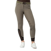 Front view of a model wearing the sage olive Equinavia Maud Knee Patch Breeches on a white background