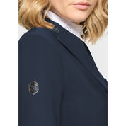 Close-up side view of a female model wearing the Navy Samshield Victory Premium Show Jacket on a plain background