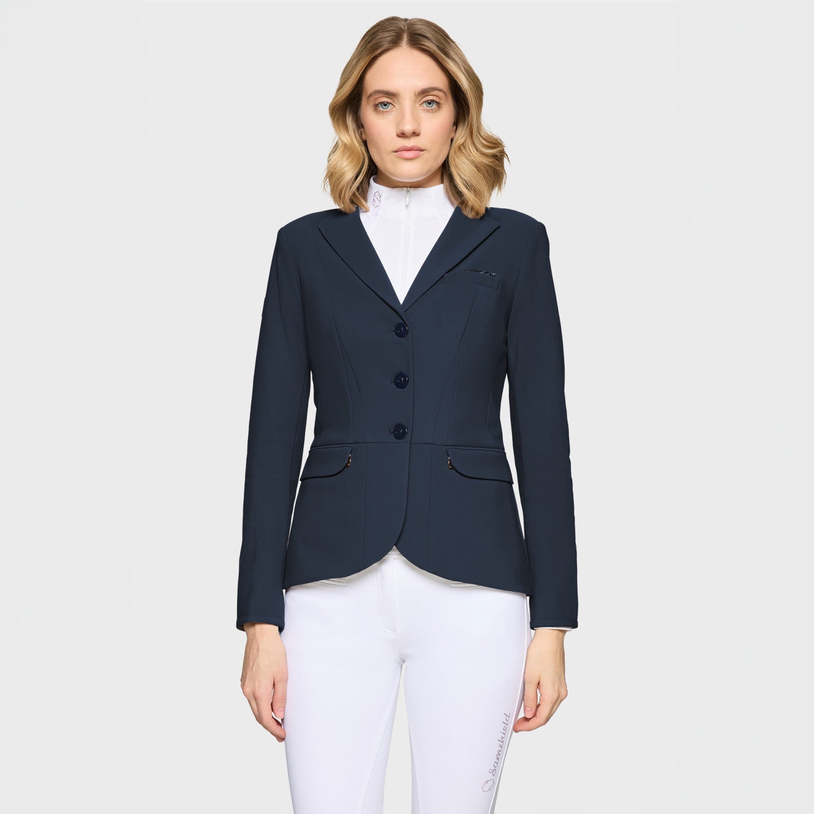 Front view of a female model wearing the Navy Samshield Victory Premium Show Jacket on a plain background