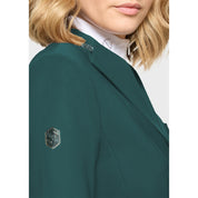 Close-up side view of a female model wearing the Hunter Green Samshield Victory Premium Show Jacket on a plain background