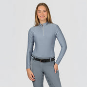 Front view of a model wearing Dusk Blue Equinavia Aurora Long Sleeve Training Shirt on a plain background