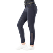 Side view of a model wearing the Equinavia Kristina Full Seat Breeches in navy on a white background
