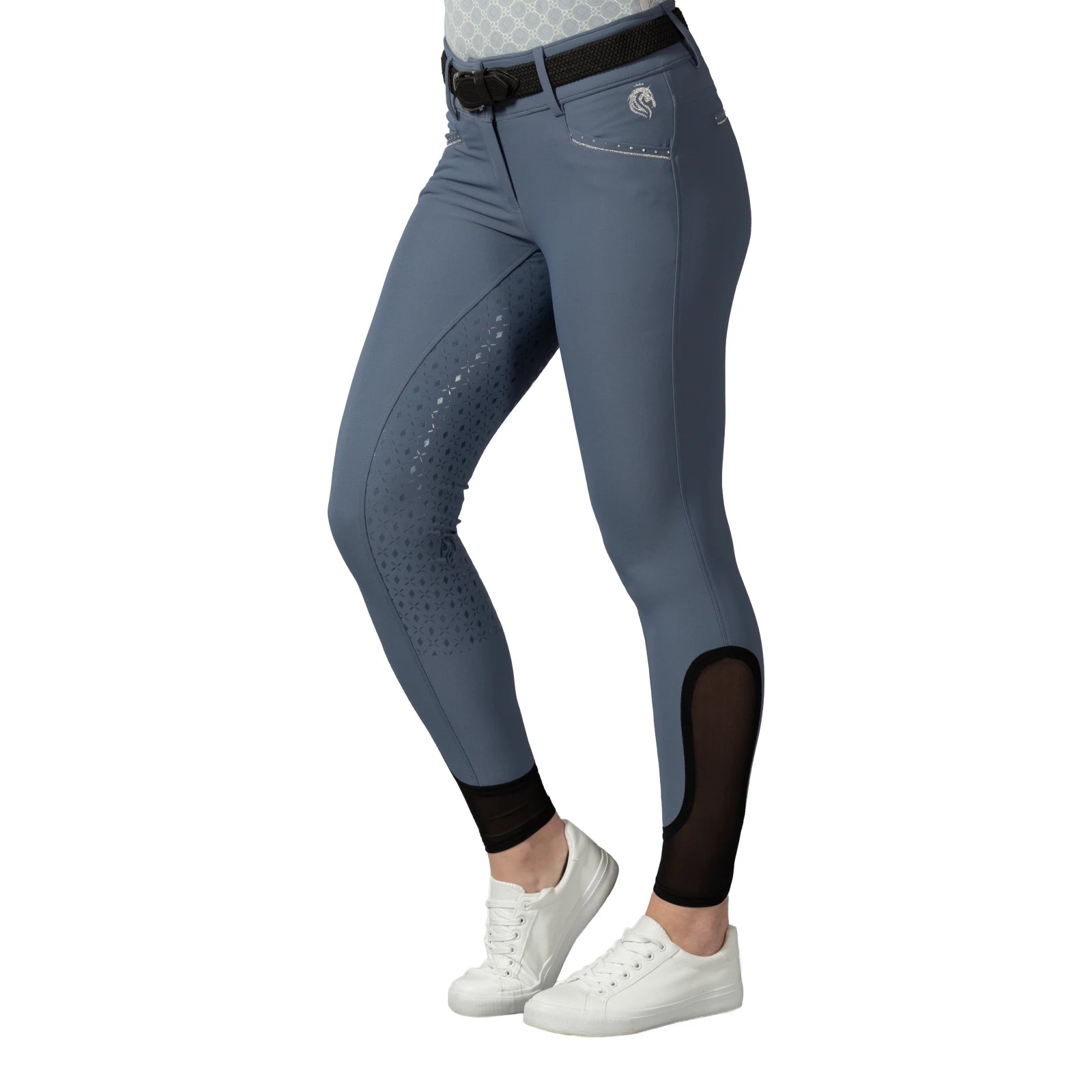 Side view of a model wearing the blue Equinavia Victoria Full Seat Breeches on a white background