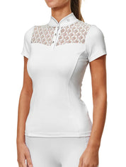 Front view of a female model wearing the white Equestrian Stockholm Crystal Champion Competition Top on a white background