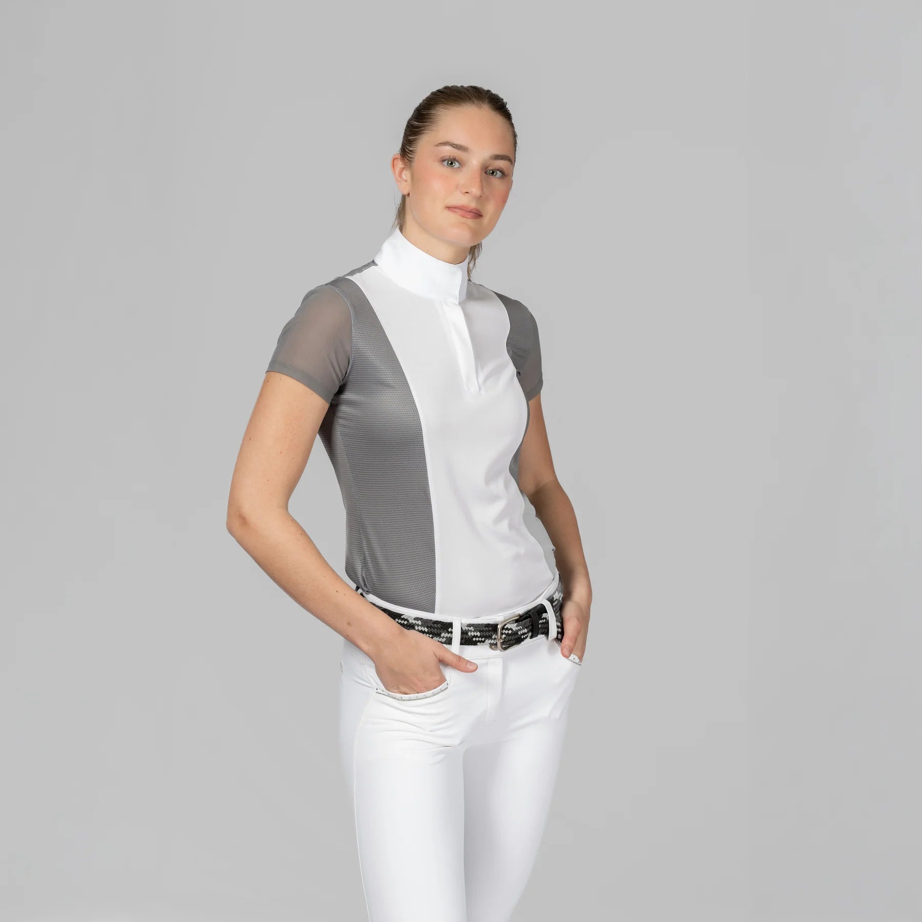 Angled front view of a model wearing Brushed Nickel Equinavia Martha Short Sleeve Show Shirt on a plain background