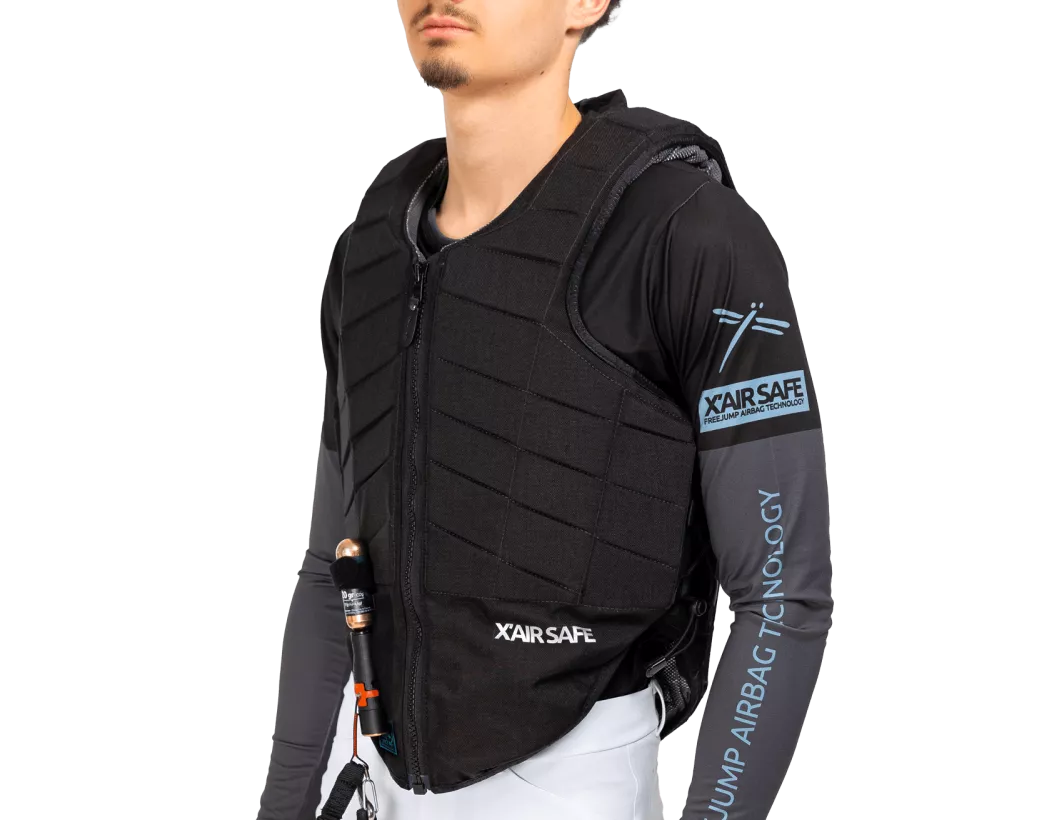 Angled front view of a male model wearing the Freejump X'Air Safe Airbag on a white background