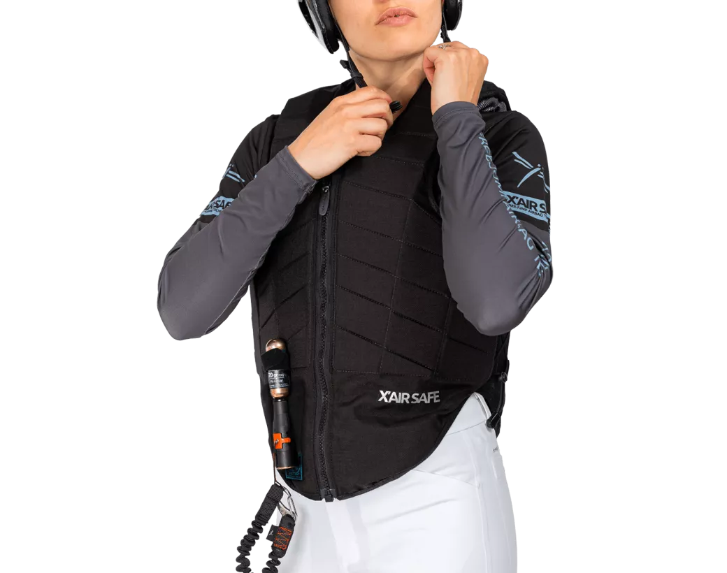 Front view of a female model wearing the Freejump X'Air Safe Airbag on a white background