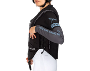 Side view of a female model wearing the Freejump X'Air Safe Airbag on a white background