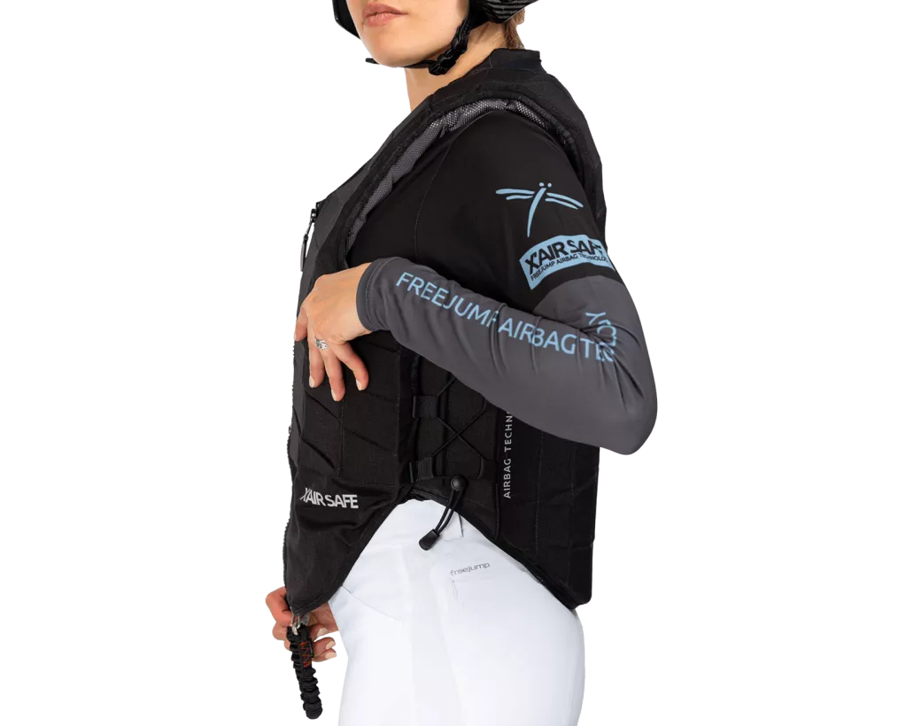 Side view of a female model wearing the Freejump X'Air Safe Airbag on a white background