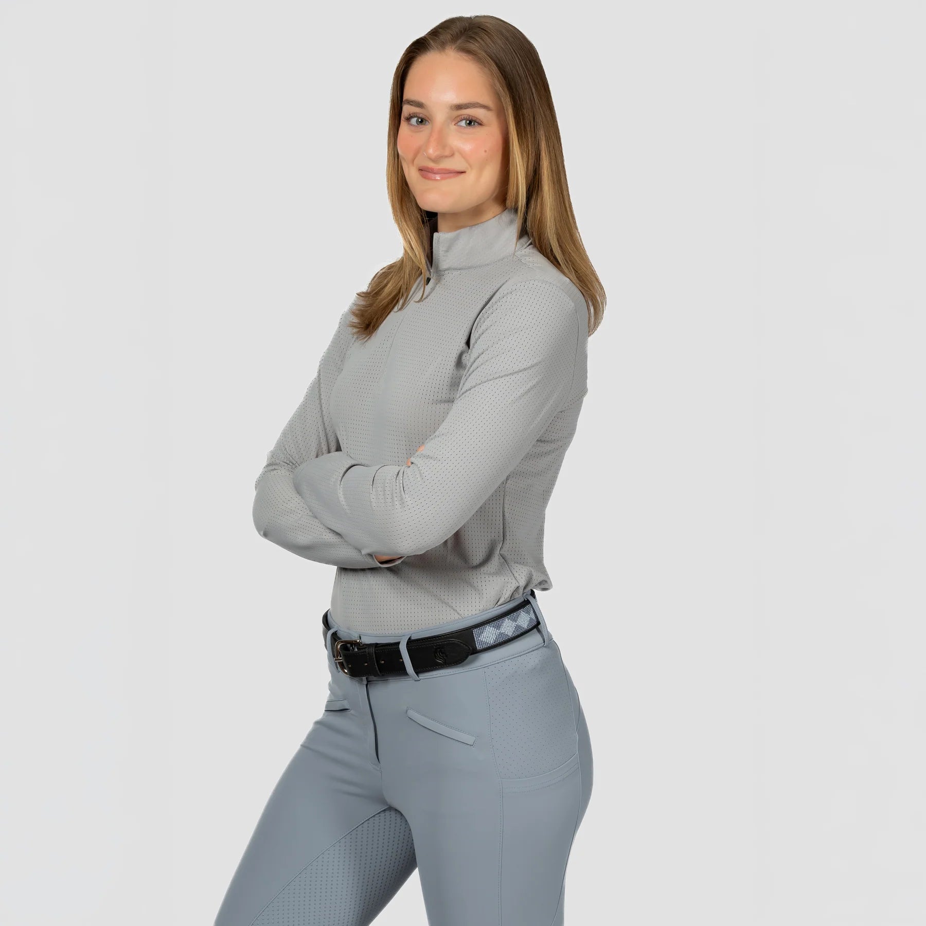 Angled side view of a model wearing Dapple Gray Equinavia Juni Long Sleeve Quarter Zip Shirt on a plain background