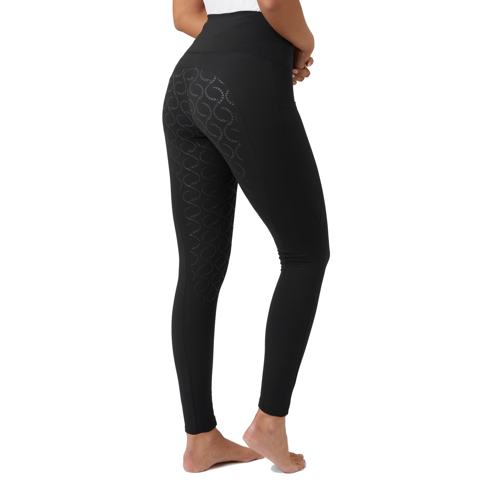 Side view of a female model wearing the black Horze Gillian Silicone Full Seat Tights on a white background