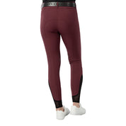 Back view of a model wearing the wine red Equinavia Maud Knee Patch Breeches on a white background