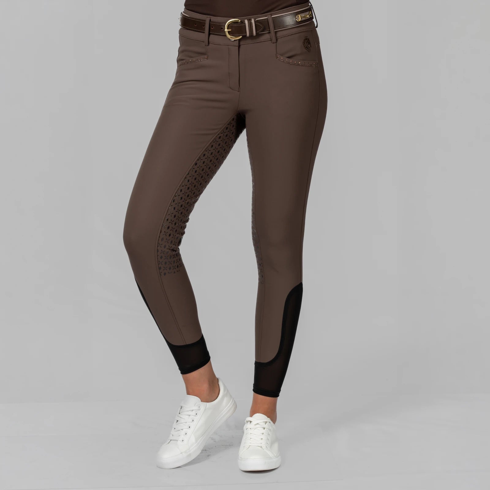 Front view of a model wearinfg the brown Equinavia Victoria Full Seat Breeches on a plain background