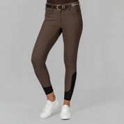 Front view of a model wearinfg the brown Equinavia Victoria Full Seat Breeches on a plain background