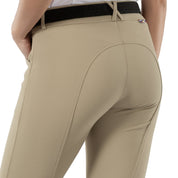 Back view of a model wearing the tan Horze Grand Prix Silicone Knee Patch Breeches on a white background