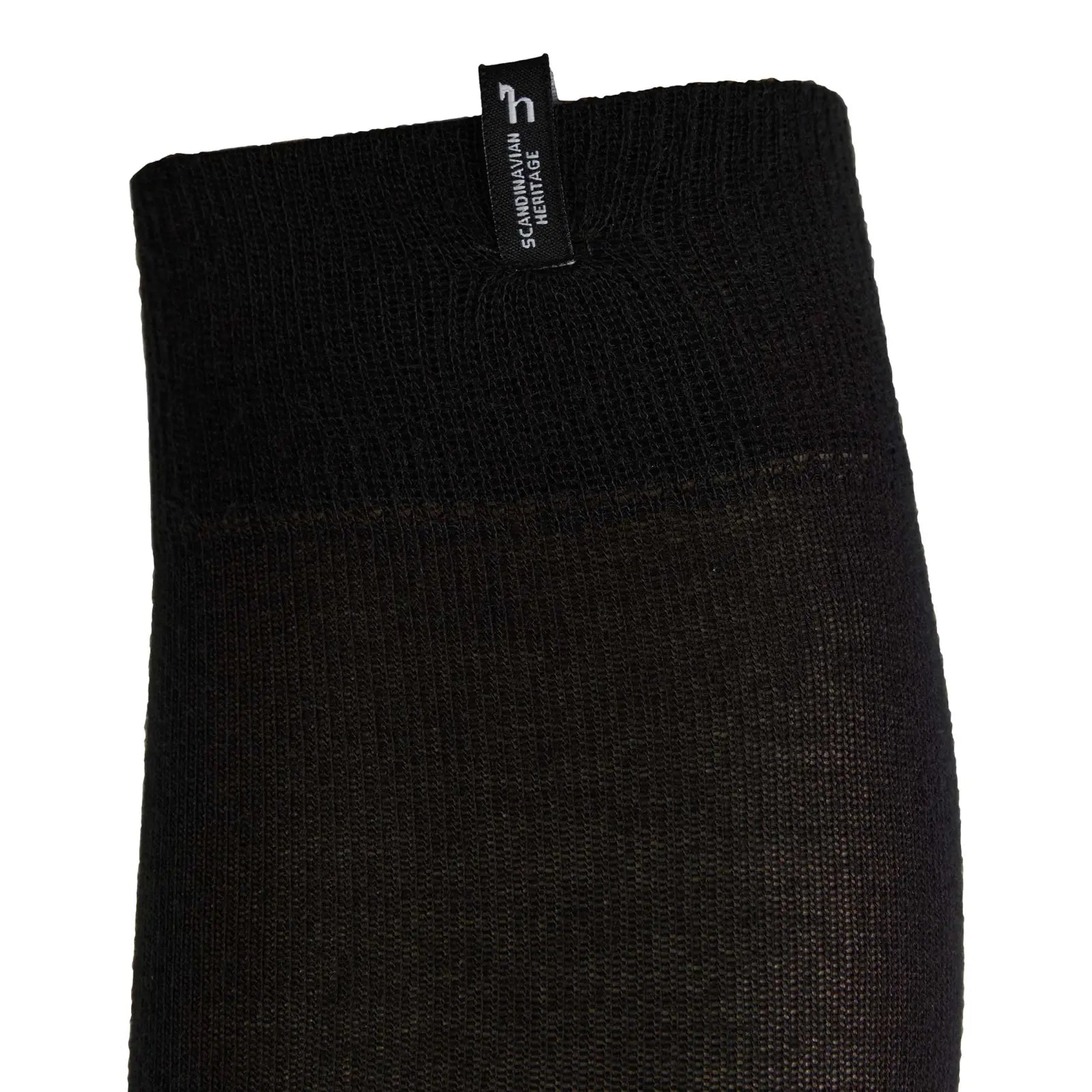 Close-up side view of the top of the Horze Ebba Technical Riding Socks in black on a white background