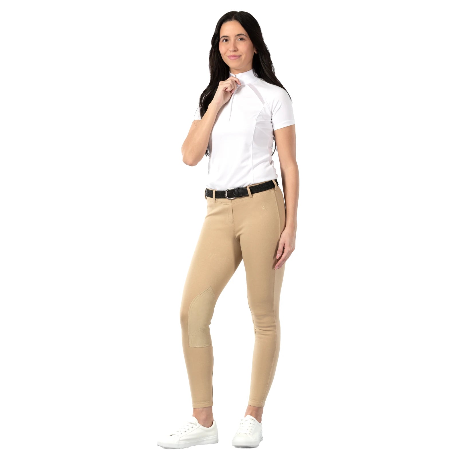 Full body view of a model wearing the black Equinavia Elsa Woven Stretch Belt, white shirt, and tan breeches on a white background