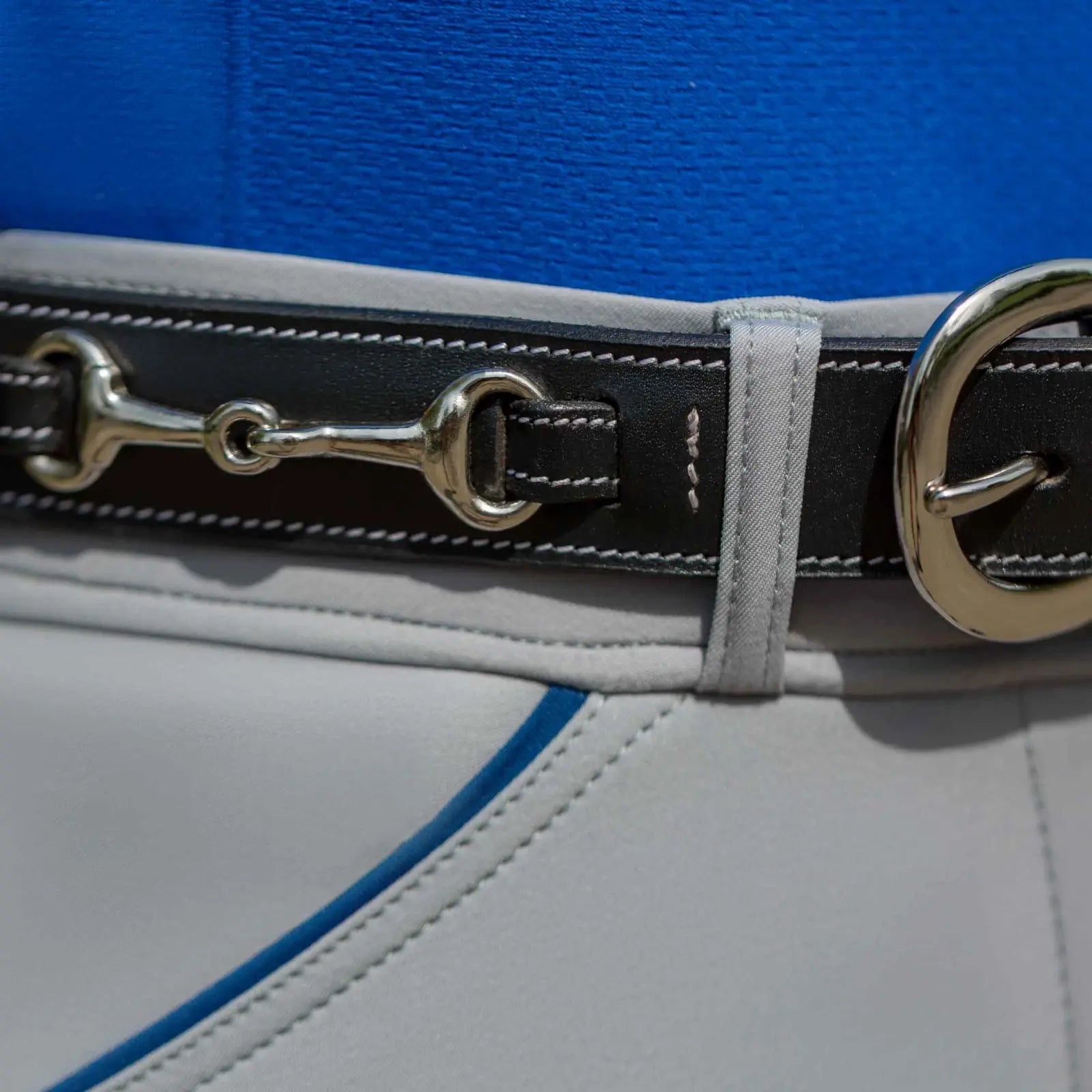 Close-up view of the black Equinavia Filippa Fancy Stitch Bit Belt on tan breeches