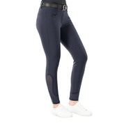 Close up side view of a model wearing the Equinavia Kristina Full Seat Breeches in navy on a white background