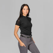 Angled front view of a female model wearing the Black Horze Mina Mesh Short Sleeve Training Shirt on a plain background